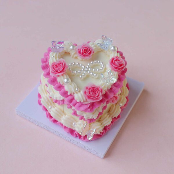 Lovely Heart-Shaped Mini Cake Set: Crafted with Pink and Yellow Icing