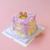 Customizable Celebration Mini Cake Kit: Yellow Base with Pink, Purple, and Yellow Icing Customizable Celebration Mini Cake Kit: Yellow Base with Pink, Purple, and Yellow Icing