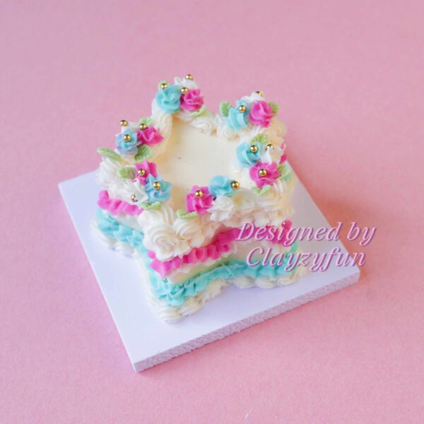 Delightful Star Mini Cake Kit Decorated with Pink, Blue, and Yellow Icing