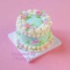 Minty Blossom Delight: A Cake Wrapped in Floral Beauty