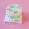 Minty Blossom Delight: A Cake Wrapped in Floral Beauty
